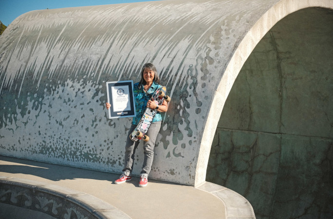 Judi holding her certificate