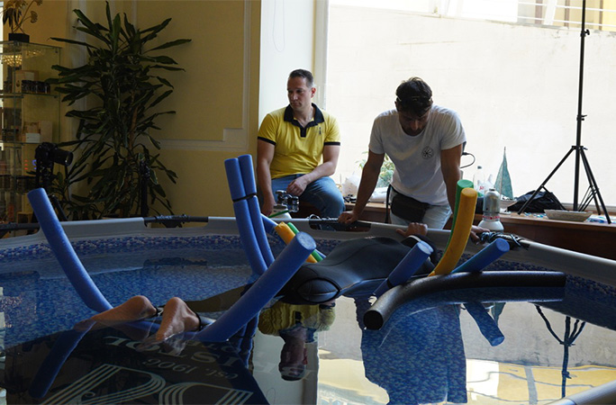 Vitomir lying on pool noodles