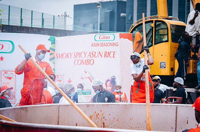 Hilda stirring with a man's help