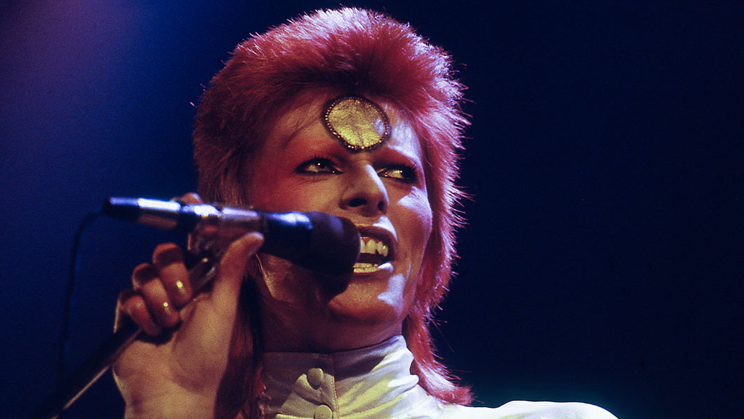 David Bowie singing on stage