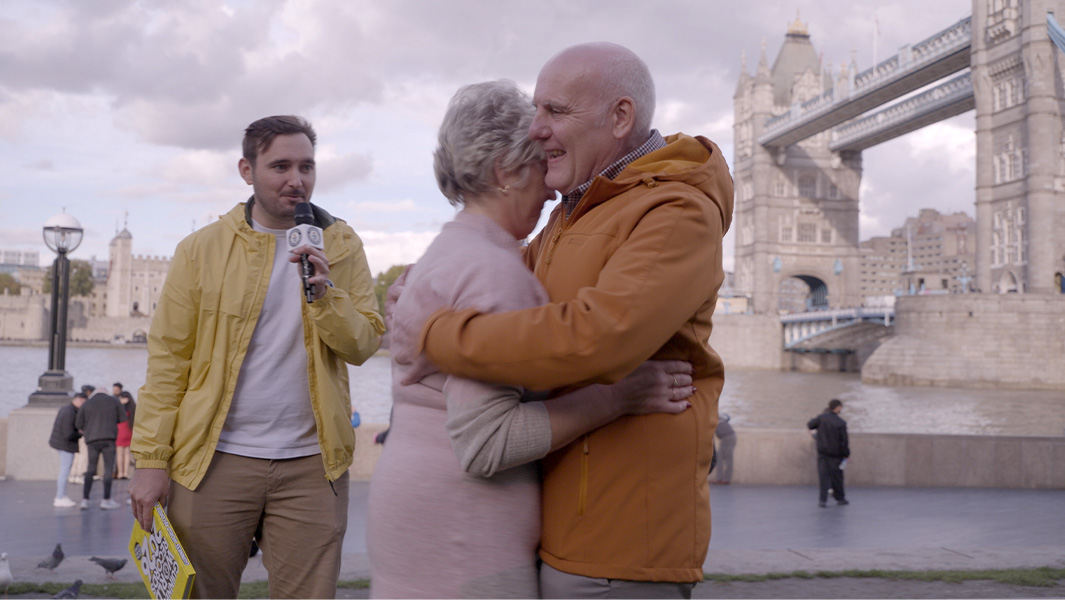 split image of couple hugging and standing next to GWR Adjudicator