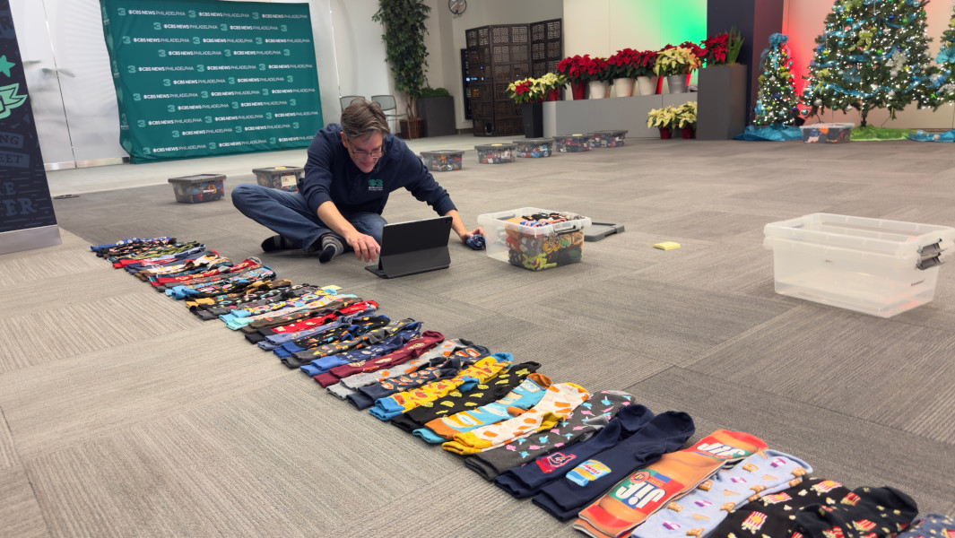 Split image of Jim's socks and Jim holding up his favorite pair
