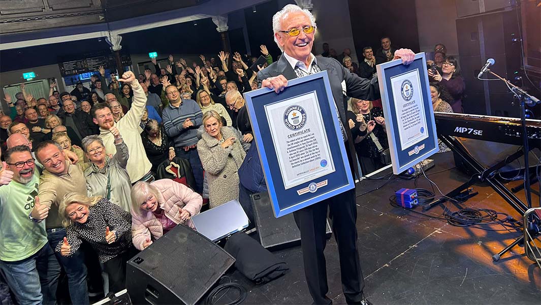 Tony Christie on stage with his GWR certificates and with Craig Glenday