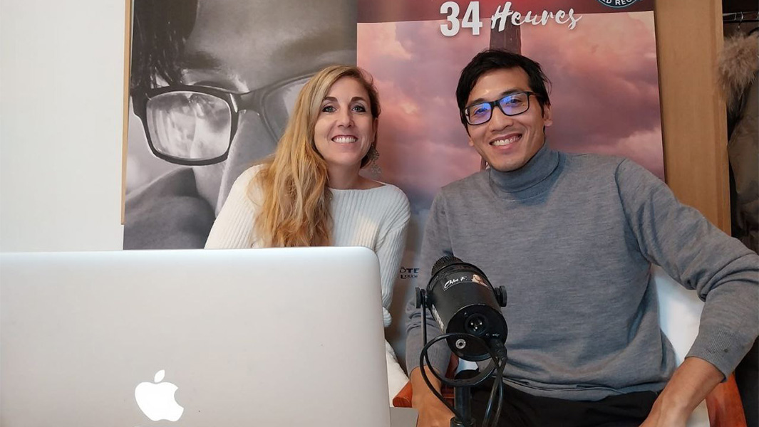 Steven and Chloe sitting at a desk during their interview