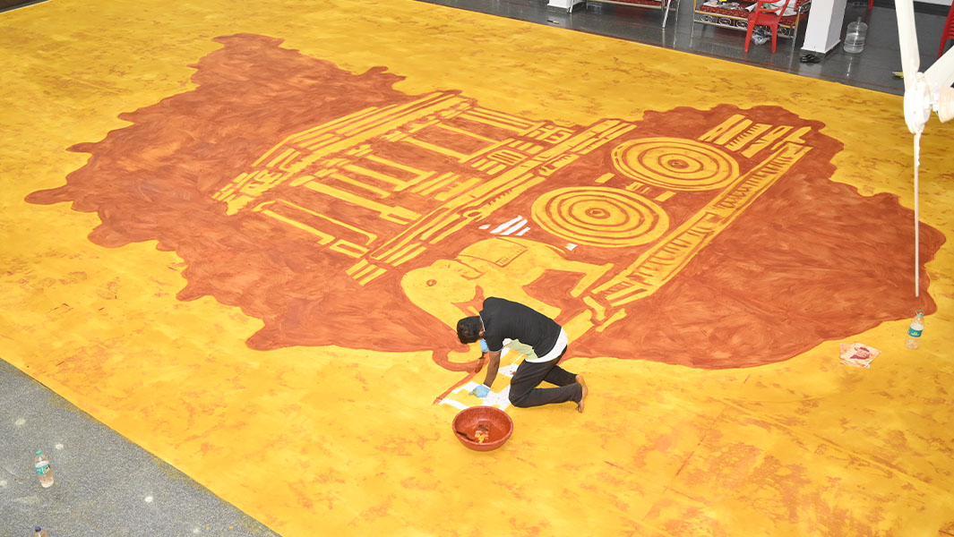 Amar working on the largest spice painting