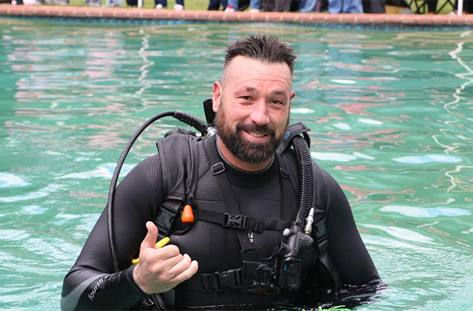 Andre in a scuba suit