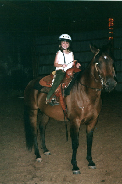 Paige as a child riding Fancy