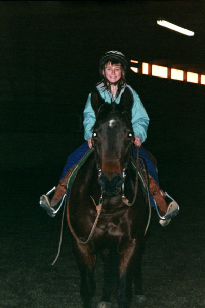 Paige riding Fancy as a child