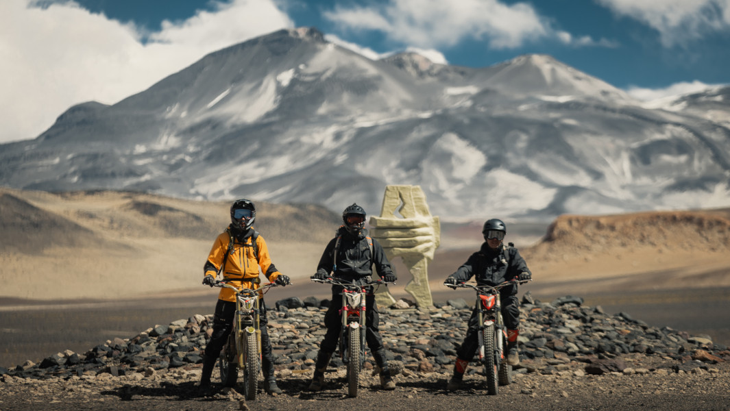 The Rencoret family on their motorcycles in front of the volcano