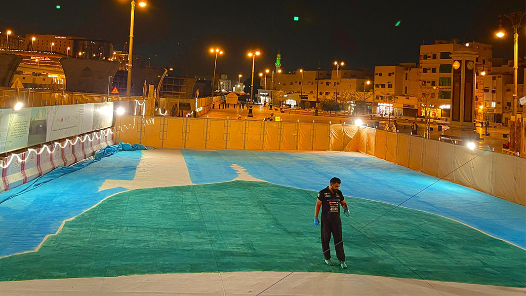 split image of Zakir working on the oil painting and the finished work