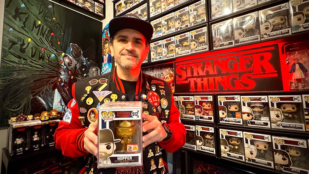 Joey surrounded by his Stranger Things collection