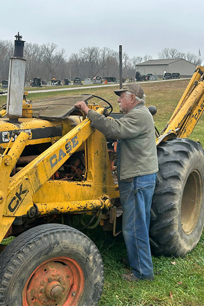 Allen working on his tractor