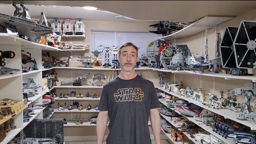 Fredrick in front of some of his assembled LEGOs