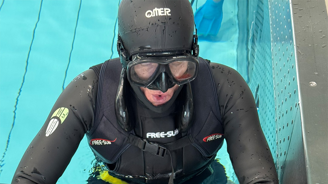split image of Stanislaw catching his breath and walking underwater