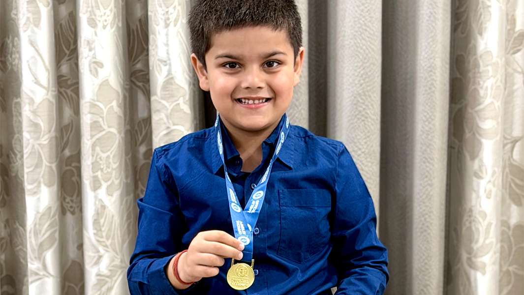 split image of Avyukt identifying dinosaurs and posing with his GWR certificate and medal
