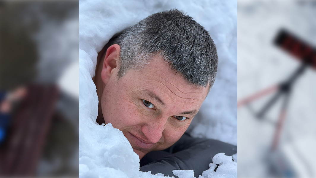 split image of Damian immersed in snow with a crowd round him and a close up of his head sticking out