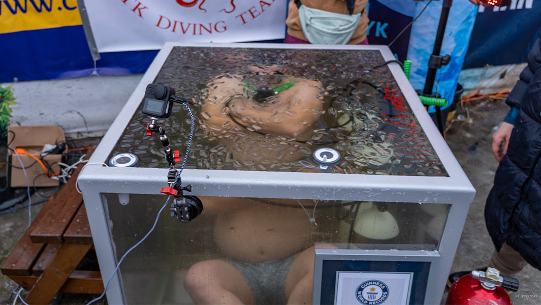 Damian in a box filled with ice water
