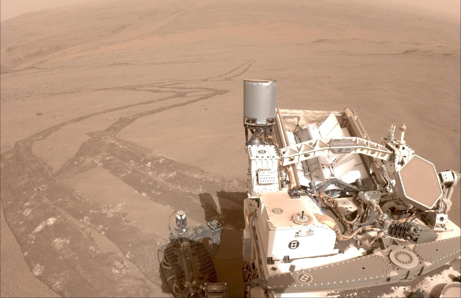 A view from the Perseverance rover, looking back at its tracks