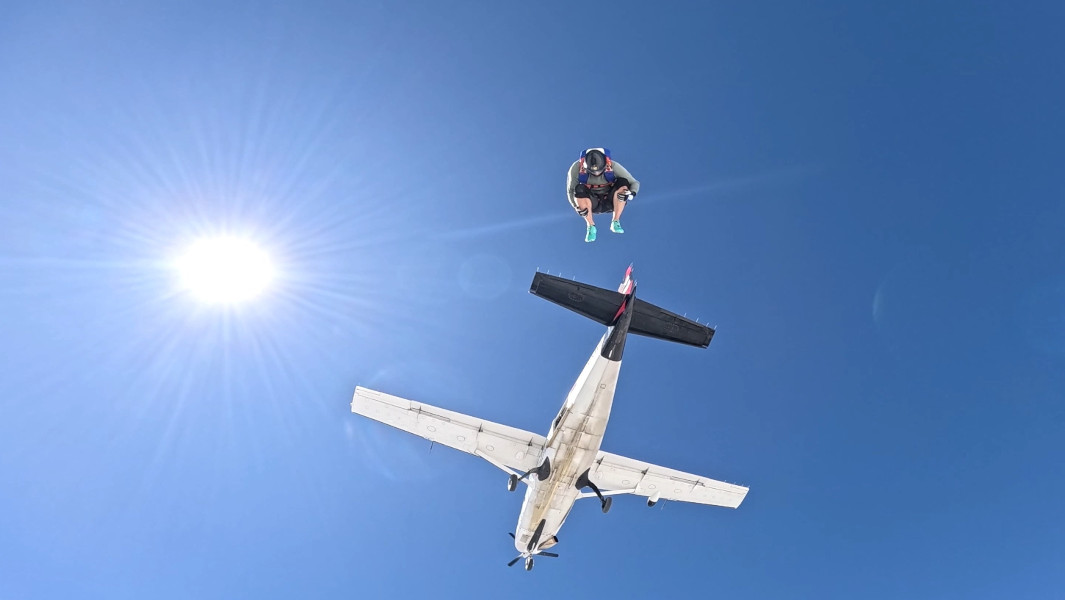 Marc-Olivier Desmarais somersaulting out of a plane