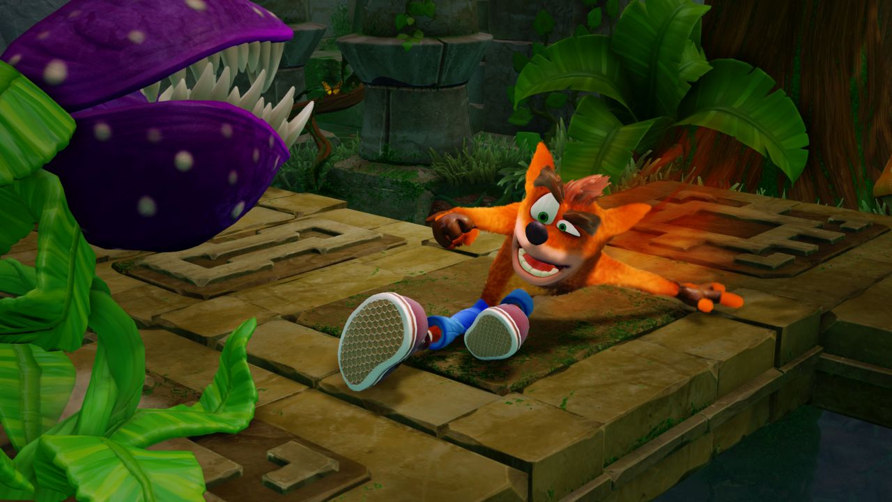 Crash Bandicoot sliding through ruins