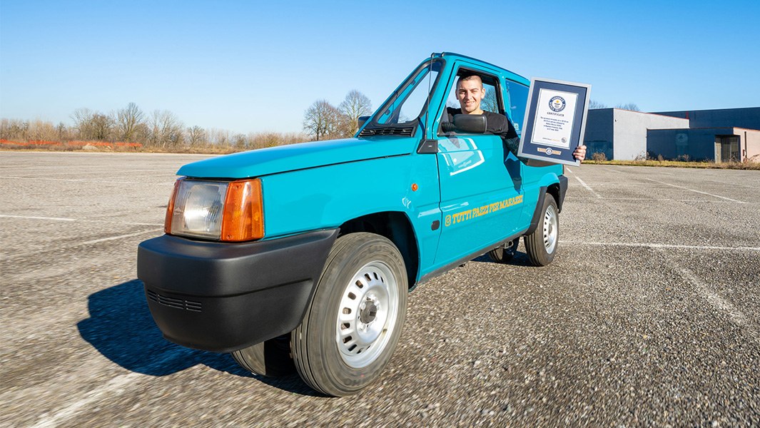A picture of the world's narrowest drivable car, and its creator Andrea Marazzi