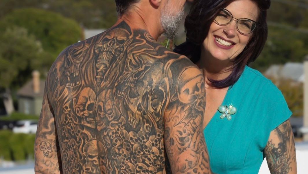 Split image of Scott and his back tattoos with his wife, and Scott holding his GWR certificate