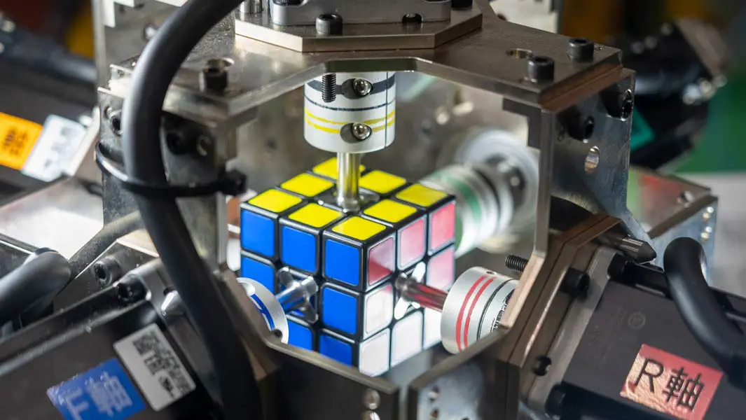 Fastest robot to solve a puzzle cube thumb
