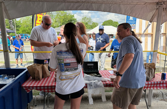 Customers buying sandwiches