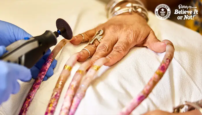 Longest fingernails being cut off