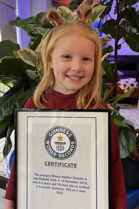 Isla holding the certificate