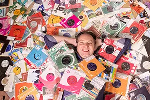 Record holder covered in CDs