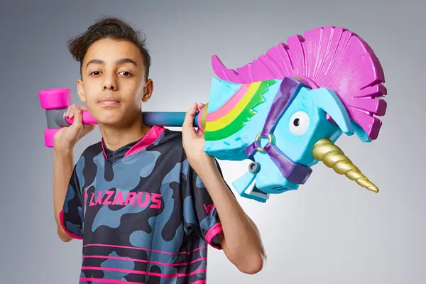 Jaden Ashman holding a toy unicorn pickaxe 