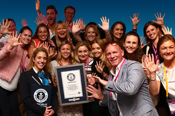 Work team celebrating a Guinness World Records title